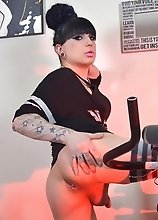 Kelly jacks off her thick dick after a hot work out